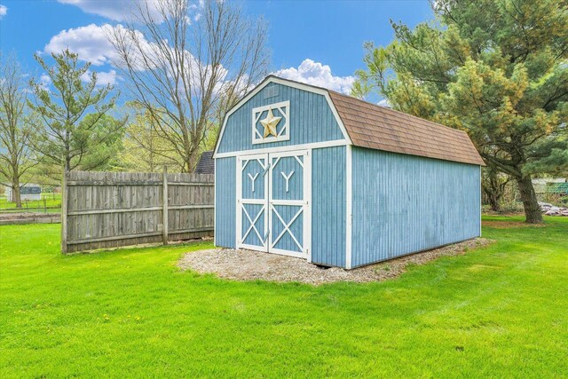view of shed with fence