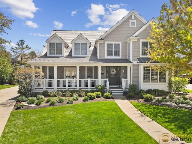 view of front of home featuring a porch and a front lawn