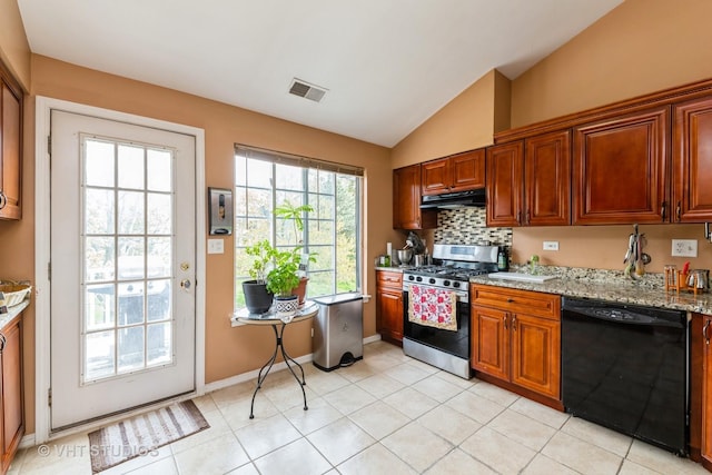 kitchen with visible vents, stainless steel gas range oven, vaulted ceiling, black dishwasher, and under cabinet range hood