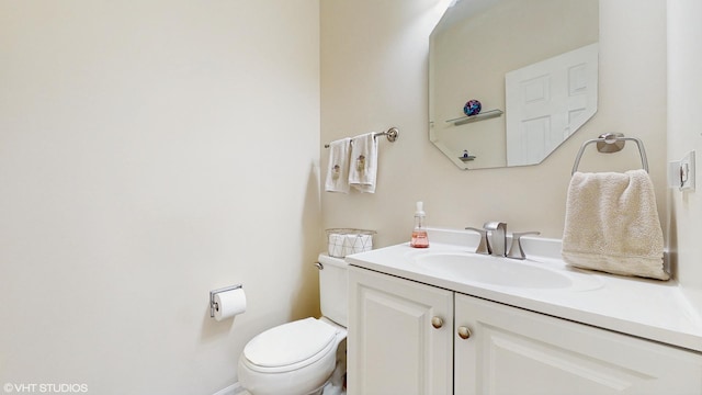 half bath with toilet and vanity