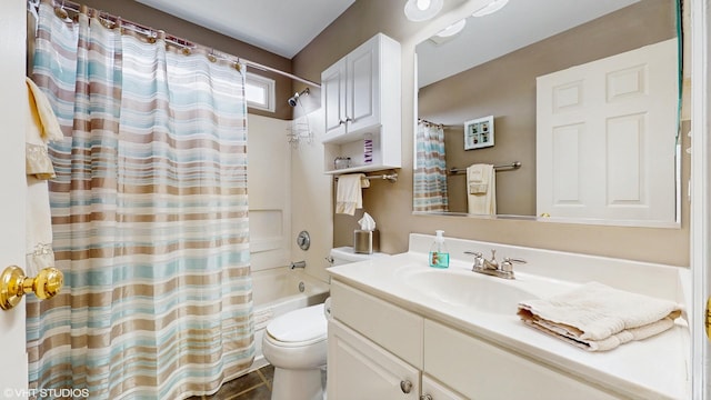 bathroom with toilet, vanity, and shower / bath combo with shower curtain