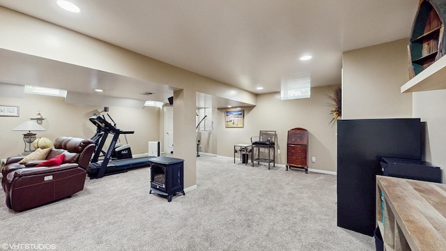 exercise room with carpet flooring, baseboards, and recessed lighting