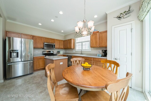 2835 Cascade Falls Cir, Elgin, IL 60124 - kitchen featuring appliances with stainless steel finishes, a sink, light countertops, a chandelier, and ornamental molding