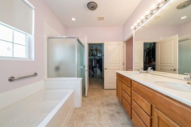 2835 Cascade Falls Cir, Elgin, IL 60124 - bathroom with a stall shower, a bath, a walk in closet, and double vanity
