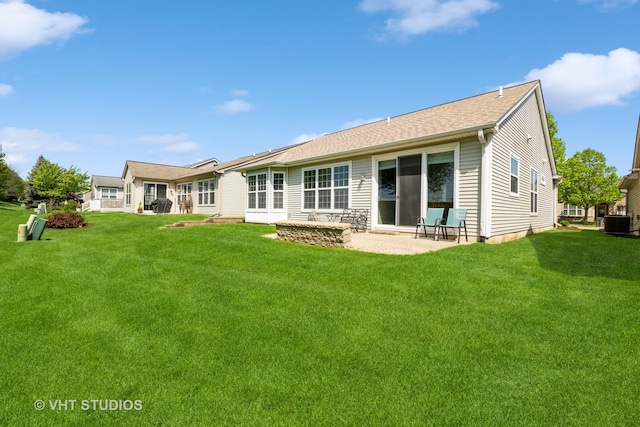 2835 Cascade Falls Cir, Elgin, IL 60124 - back of house with central air condition unit, a lawn, and a patio area