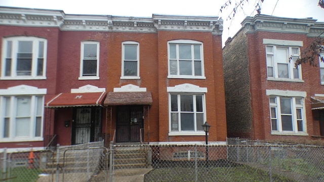 1910 S Spaulding Ave, Chicago, IL 60623 - view of property featuring brick siding and a fenced front yard