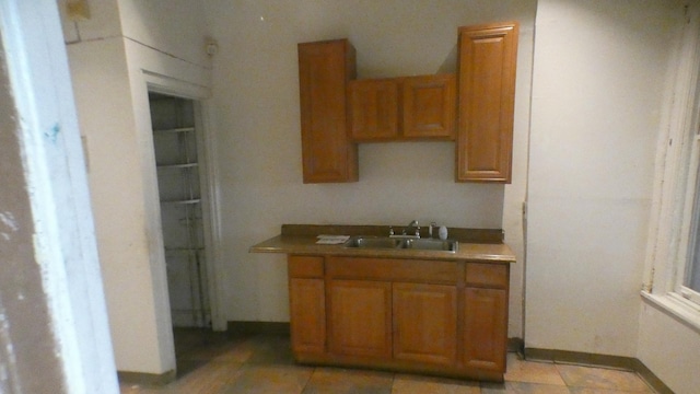 1910 S Spaulding Ave, Chicago, IL 60623 - kitchen with brown cabinetry and a sink