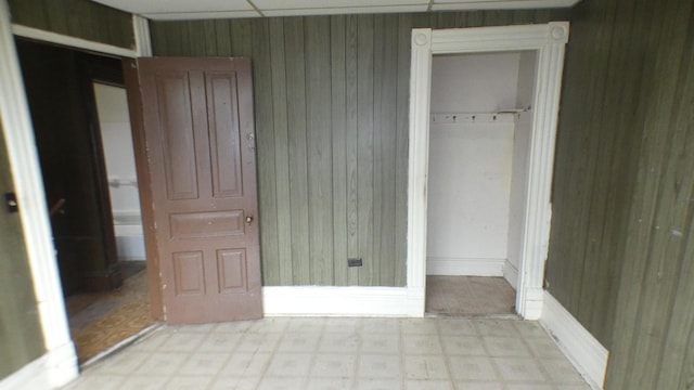 1910 S Spaulding Ave, Chicago, IL 60623 - unfurnished bedroom with wood walls and light floors
