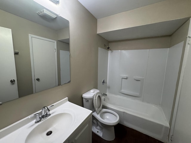 bathroom with toilet, visible vents, shower / tub combination, and vanity
