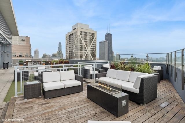 600 N Lake Shore Dr Unit 1309, Chicago, IL 60611 - wooden deck featuring a city view and outdoor lounge area