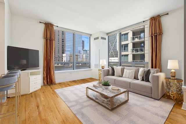600 N Lake Shore Dr Unit 1309, Chicago, IL 60611 - living room featuring baseboards, visible vents, and wood finished floors