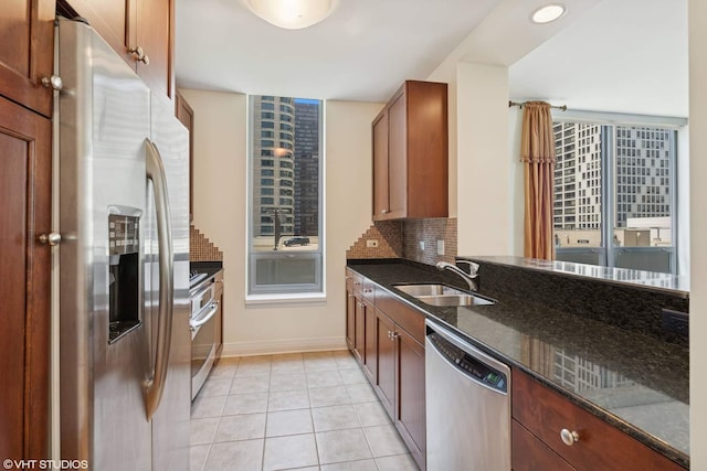 600 N Lake Shore Dr Unit 1309, Chicago, IL 60611 - kitchen with light tile patterned flooring, a sink, dark stone countertops, decorative backsplash, and stainless steel appliances