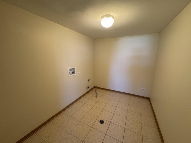 clothes washing area with laundry area, baseboards, gas dryer hookup, and hookup for a washing machine