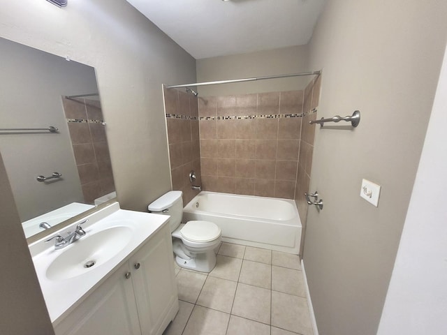 bathroom featuring tile patterned floors, vanity, toilet, and shower / tub combination