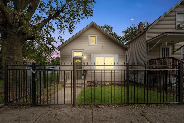 exterior space with a gate, a fenced front yard, and a front yard