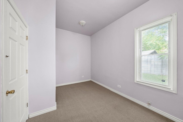 interior space with carpet floors and baseboards