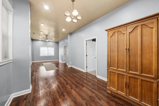 entrance foyer with dark wood-type flooring, recessed lighting, baseboards, and ceiling fan with notable chandelier