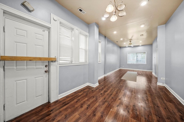 foyer with visible vents, baseboards, wood-type flooring, a notable chandelier, and recessed lighting