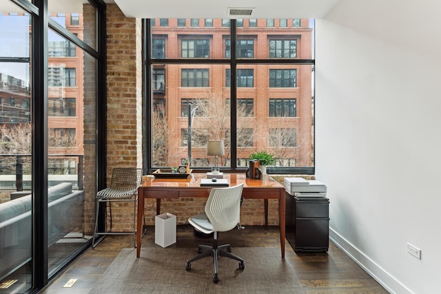 office with baseboards, wood finished floors, and visible vents