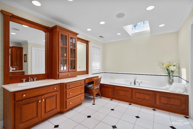 bathroom with a skylight, vanity, crown molding, and a bath