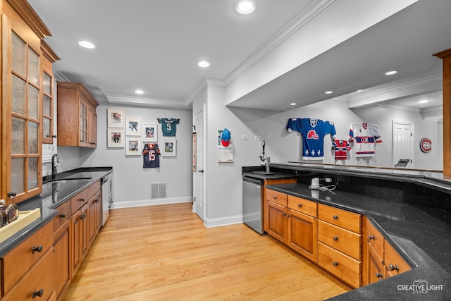 kitchen with stainless steel dishwasher, light wood-type flooring, a sink, ornamental molding, and recessed lighting