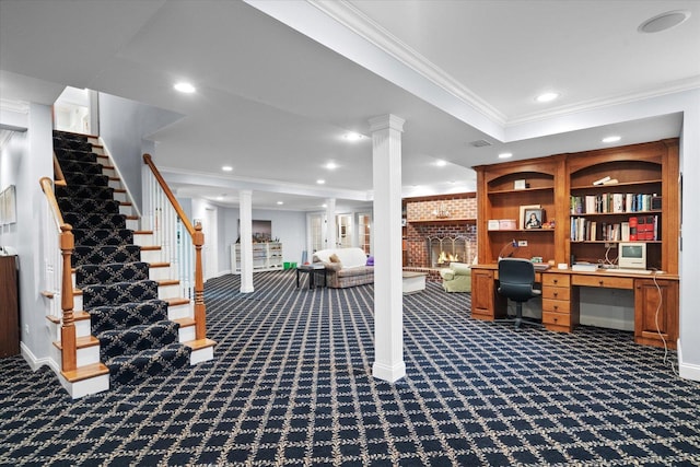 office featuring recessed lighting, ornamental molding, a brick fireplace, and dark carpet