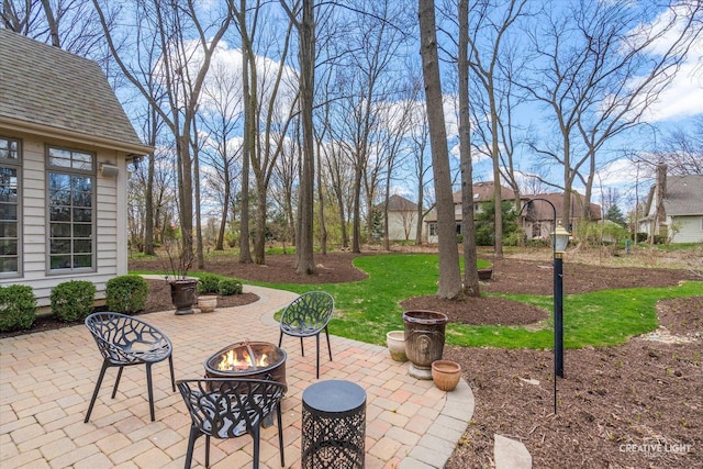 view of patio with an outdoor fire pit