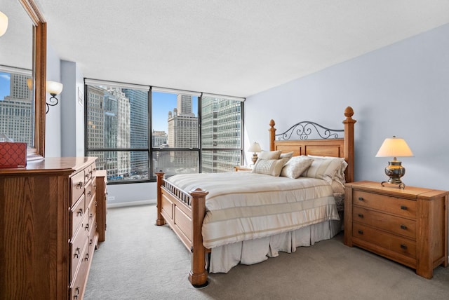 bedroom featuring a view of city and light colored carpet