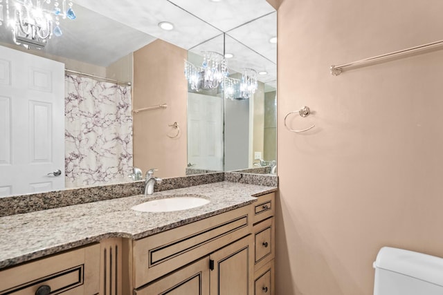 full bathroom with a shower with curtain, vanity, toilet, a chandelier, and recessed lighting