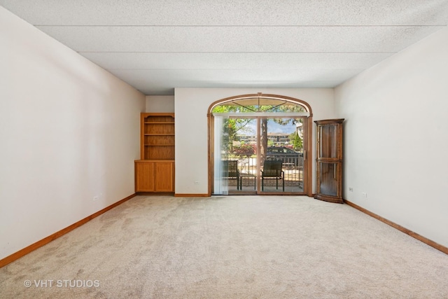 9439 S 79th Ave Unit 102, Hickory Hills, IL 60457 - empty room with carpet, baseboards, and a textured ceiling