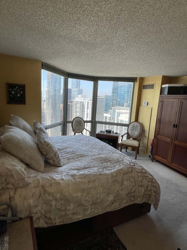 195 N Harbor Dr Unit 4908, Chicago, IL 60601 - bedroom featuring light carpet, a city view, a textured ceiling, and visible vents