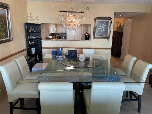 195 N Harbor Dr Unit 4908, Chicago, IL 60601 - dining room with an inviting chandelier, a textured ceiling, and tile patterned flooring