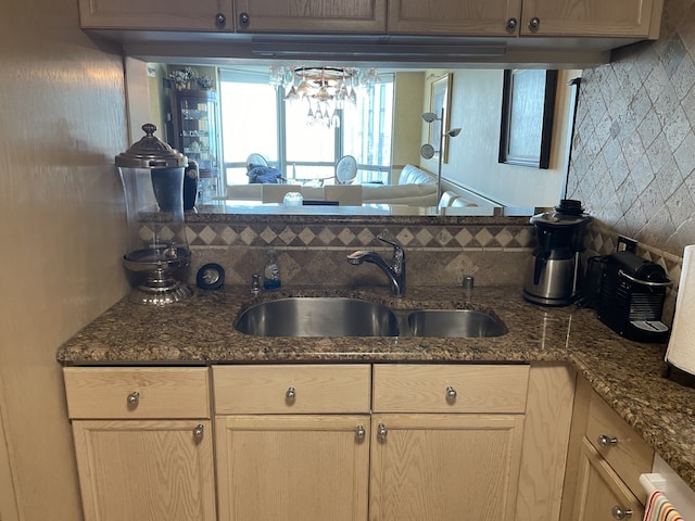 195 N Harbor Dr Unit 4908, Chicago, IL 60601 - kitchen with dark stone counters, a sink, and tasteful backsplash
