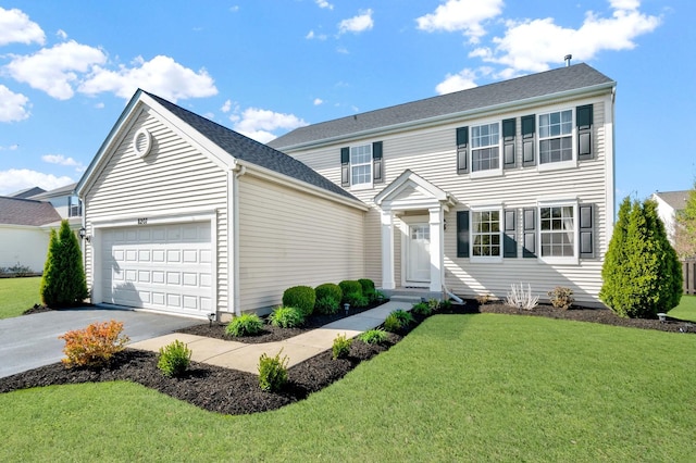 view of front of house with an attached garage, concrete driveway, and a front yard