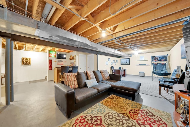 living area with finished concrete floors and visible vents