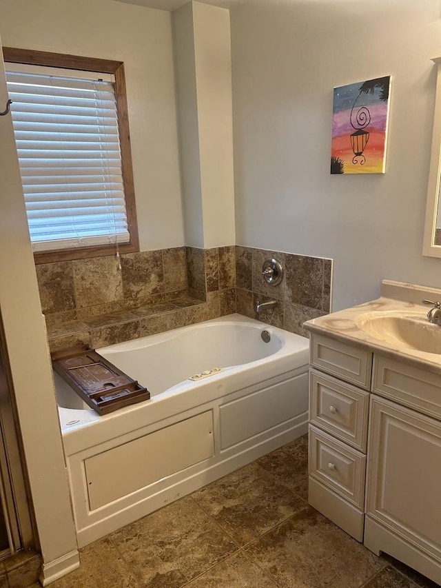 full bathroom featuring a bath and vanity