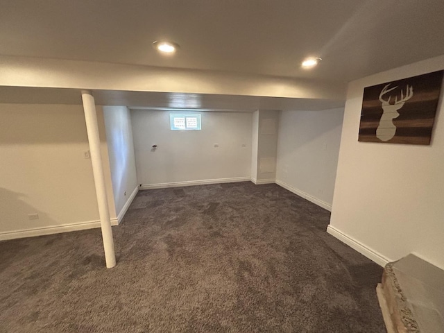 basement with recessed lighting, baseboards, and dark carpet