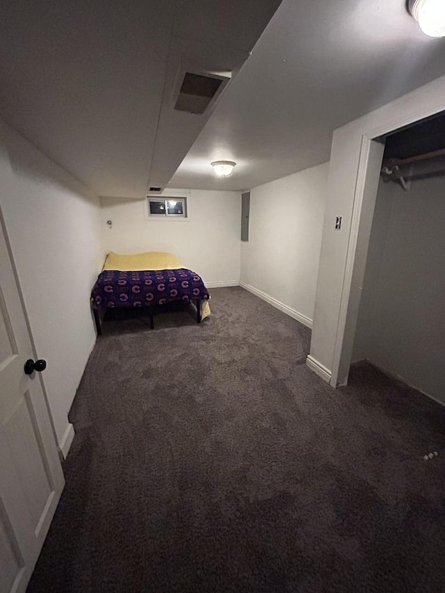 carpeted bedroom featuring baseboards