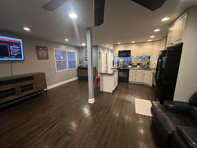 living area featuring dark wood-type flooring, recessed lighting, baseboards, and ceiling fan