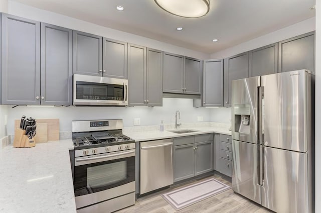 1111 S State St Unit A500, Chicago, IL 60605 - kitchen with recessed lighting, gray cabinets, appliances with stainless steel finishes, and a sink