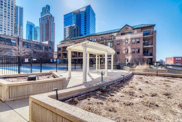 1111 S State St Unit A500, Chicago, IL 60605 - exterior space featuring fence, a pergola, a patio, a pool, and a view of city