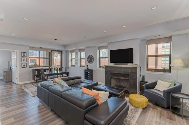 1111 S State St Unit A500, Chicago, IL 60605 - living area with recessed lighting, baseboards, a tiled fireplace, and wood finished floors