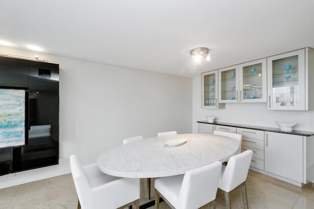 dining room featuring light tile patterned floors
