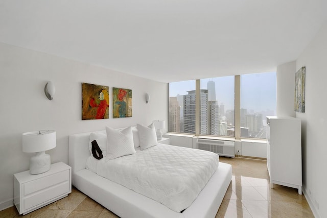 bedroom with a view of city, light tile patterned flooring, and baseboards