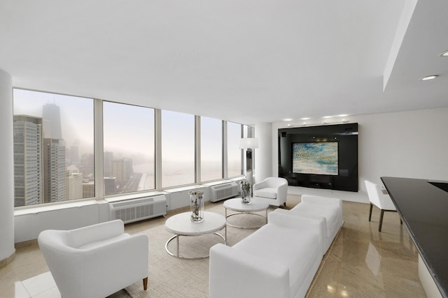 living area with an AC wall unit and recessed lighting