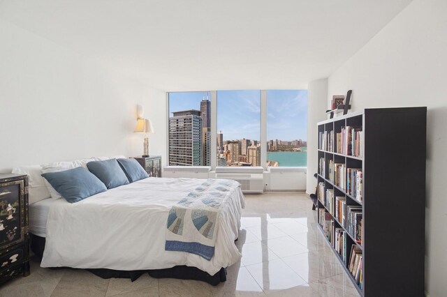 505 N Lake Shore Dr Unit 4412, Chicago, IL 60611 - bedroom with a view of city, light tile patterned floors, and light colored carpet