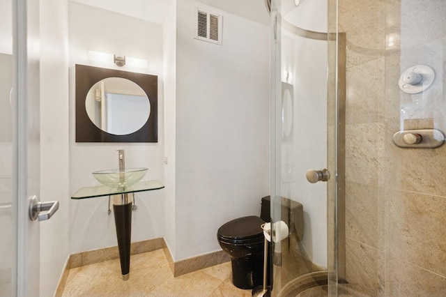 505 N Lake Shore Dr Unit 4412, Chicago, IL 60611 - bathroom with a shower stall, toilet, baseboards, and a sink