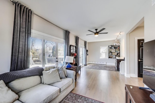 360 W Maple St, Lombard, IL 60148 - living area featuring ceiling fan, visible vents, rail lighting, wood finished floors, and a baseboard heating unit