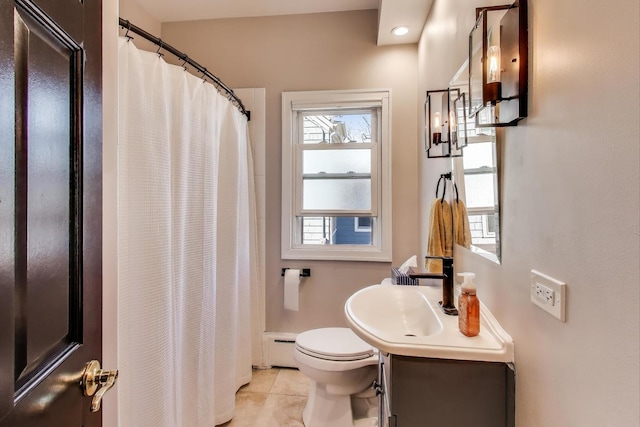 360 W Maple St, Lombard, IL 60148 - full bathroom with vanity, toilet, a shower with shower curtain, tile patterned floors, and a baseboard radiator