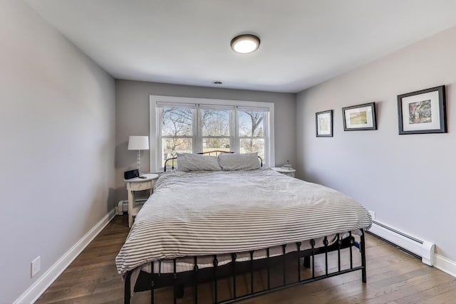 360 W Maple St, Lombard, IL 60148 - bedroom featuring baseboards, baseboard heating, and wood finished floors